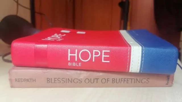 Image of a hope Bible placed on top of another book